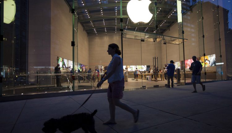 Consumers Shop At An Apple Inc. Store Ahead Of Earnings Figures